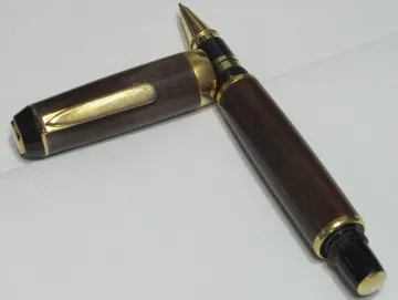Robusto style rollerball turned from hardwood with 24kt gold trim